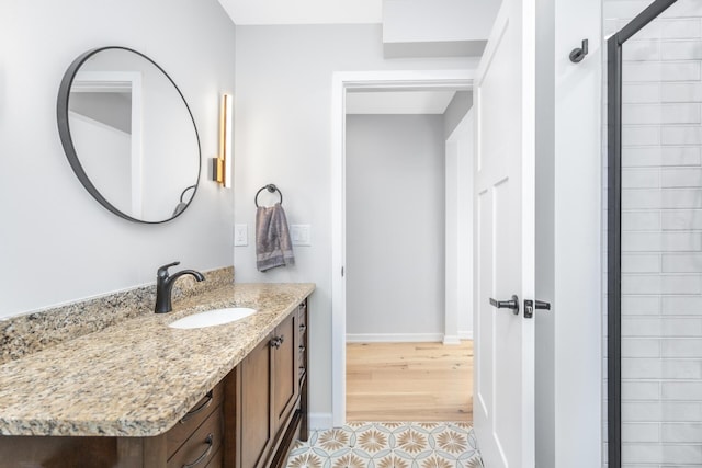 1435 Harpst St, Ann Arbor, MI 48104 - full bath featuring vanity, a tile shower, baseboards, and tile patterned flooring