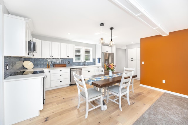 1435 Harpst St, Ann Arbor, MI 48104 - dining area with light wood finished floors, recessed lighting, and baseboards