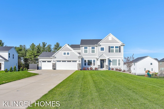 9235 Bigleaf Dr, West Olive, MI 49460 - view of front of house featuring driveway, stone siding, and an attached garage