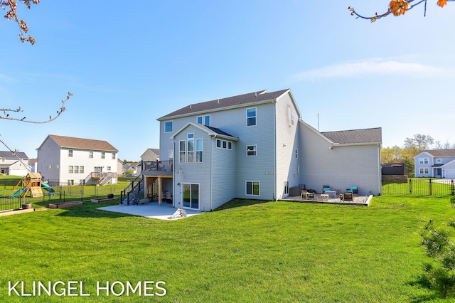 9235 Bigleaf Dr, West Olive, MI 49460 - back of property featuring a patio, a deck, a playground, a residential view, and stairway