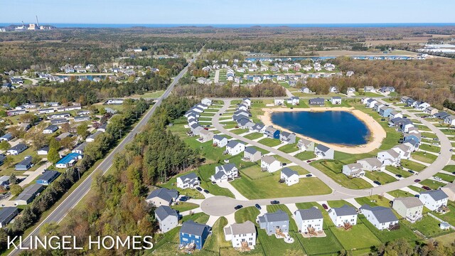9235 Bigleaf Dr, West Olive, MI 49460 - aerial view of property and surrounding area with a large body of water and nearby suburban area