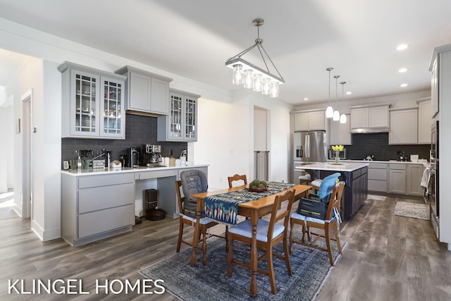 9235 Bigleaf Dr, West Olive, MI 49460 - dining space featuring dark wood-style floors and recessed lighting