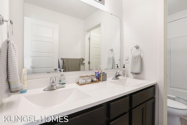 9235 Bigleaf Dr, West Olive, MI 49460 - full bathroom featuring double vanity and toilet