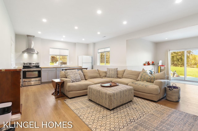 9235 Bigleaf Dr, West Olive, MI 49460 - living room with light wood-style floors and recessed lighting