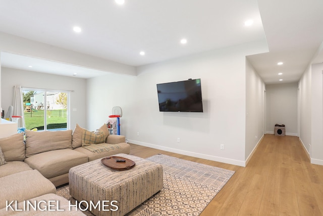 9235 Bigleaf Dr, West Olive, MI 49460 - living area with light wood-style flooring, recessed lighting, and baseboards