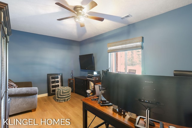 9235 Bigleaf Dr, West Olive, MI 49460 - office area featuring wood finished floors, ceiling fan, and baseboards