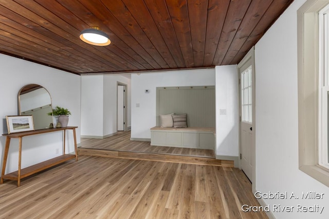 unfurnished room featuring wooden ceiling and wood finished floors
