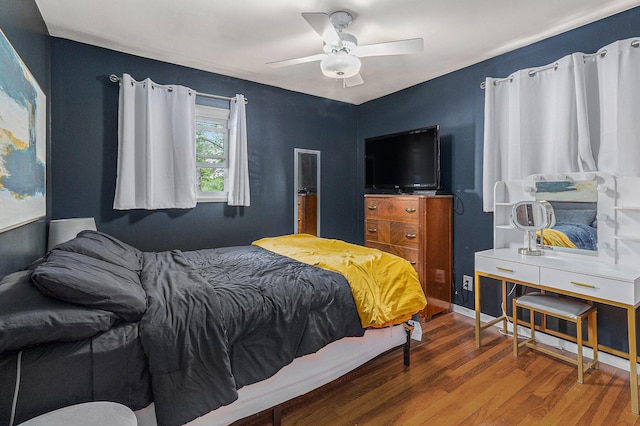 bedroom with wood finished floors and ceiling fan