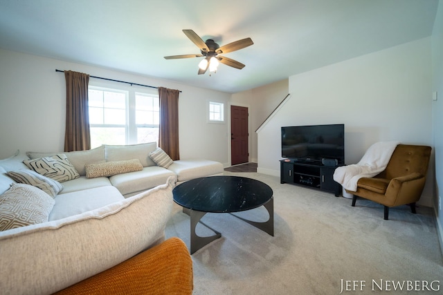 living room with ceiling fan and carpet floors