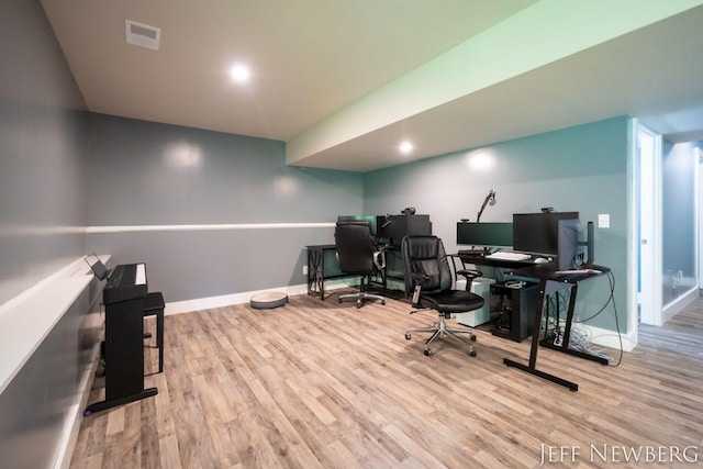 office area with wood finished floors and baseboards