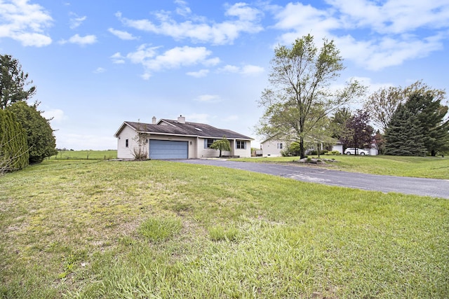 6001 Dover Ln, Traverse City, MI 49684 - ranch-style house with a garage, asphalt driveway, a front lawn, and a chimney