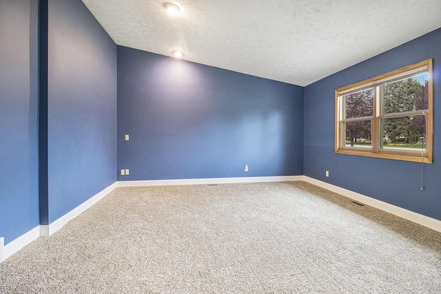 6001 Dover Ln, Traverse City, MI 49684 - spare room with carpet floors and baseboards