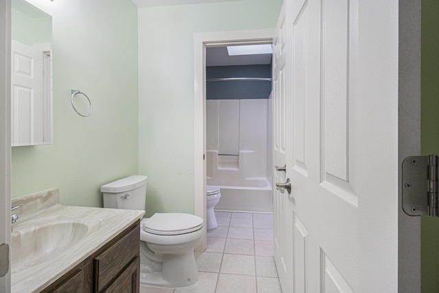 6001 Dover Ln, Traverse City, MI 49684 - bathroom with toilet, vanity, tile patterned floors, and bathing tub / shower combination