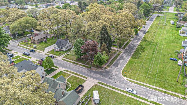 aerial view of property's location featuring a tree filled landscape