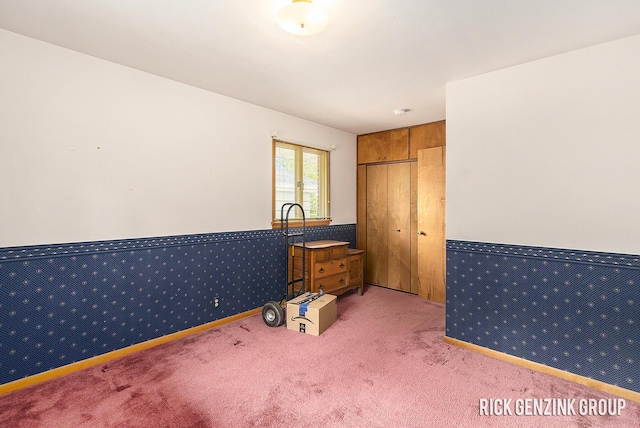 28 W 34th St, Holland, MI 49423 - unfurnished bedroom featuring light carpet and wainscoting