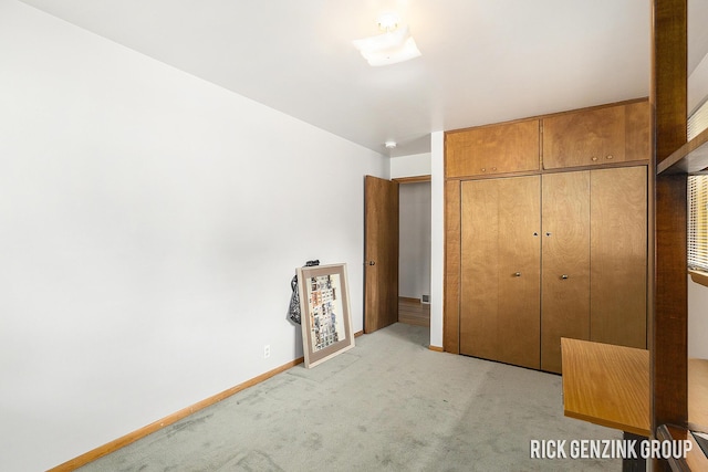 28 W 34th St, Holland, MI 49423 - unfurnished bedroom with light carpet and baseboards