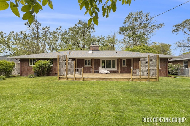 28 W 34th St, Holland, MI 49423 - rear view of property featuring brick siding, a deck, and a chimney