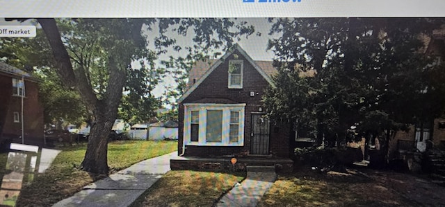 15717 Sorrento St, Detroit, MI 48227 - view of front of home with a front lawn and brick siding