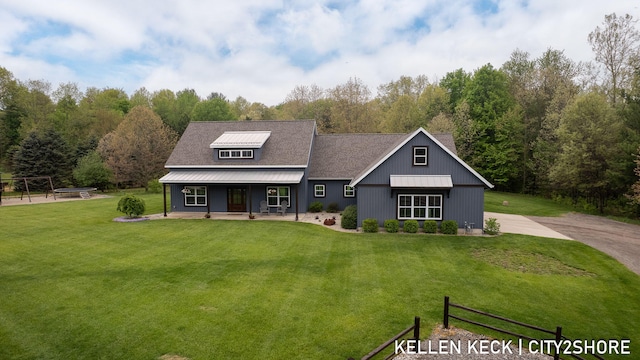 2263 136th Ave, Dorr, MI 49323 - view of front of property with a porch and a front lawn