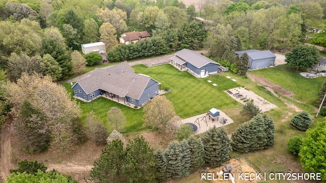 2263 136th Ave, Dorr, MI 49323 - aerial view of property and surrounding area featuring a heavily wooded area