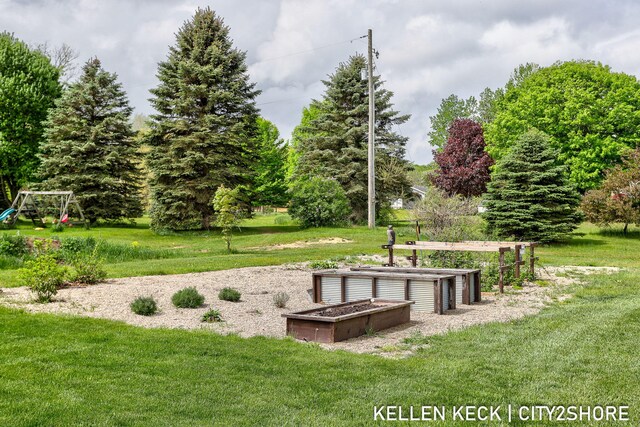 2263 136th Ave, Dorr, MI 49323 - view of community featuring a yard and a playground