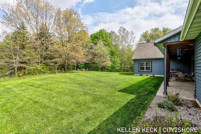 2263 136th Ave, Dorr, MI 49323 - view of grassy yard featuring a patio area