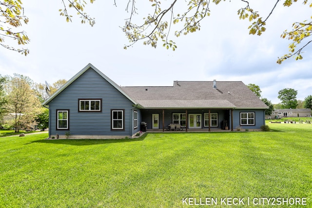 2263 136th Ave, Dorr, MI 49323 - rear view of property featuring a yard, a patio, and roof with shingles