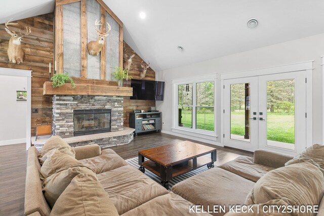 2263 136th Ave, Dorr, MI 49323 - living room with high vaulted ceiling, a stone fireplace, wood finished floors, baseboards, and recessed lighting