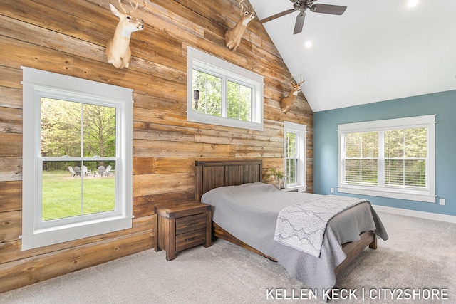 2263 136th Ave, Dorr, MI 49323 - bedroom featuring lofted ceiling, carpet flooring, multiple windows, wooden walls, and recessed lighting