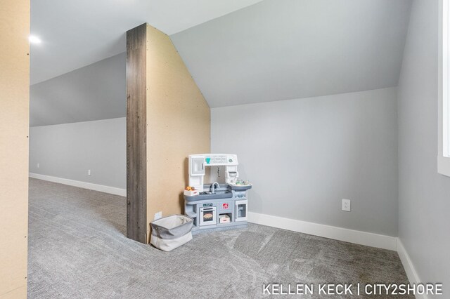 2263 136th Ave, Dorr, MI 49323 - additional living space featuring lofted ceiling, carpet, and baseboards