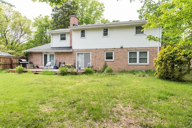 2707 Lomond Dr, Kalamazoo, MI 49008 - rear view of property featuring brick siding and a chimney