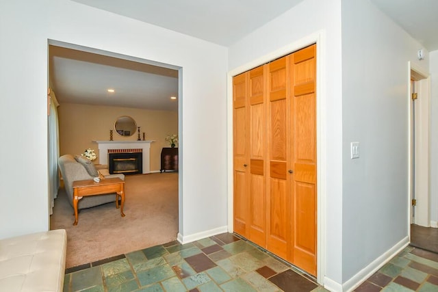 2707 Lomond Dr, Kalamazoo, MI 49008 - foyer entrance featuring a fireplace, dark colored carpet, baseboards, and recessed lighting