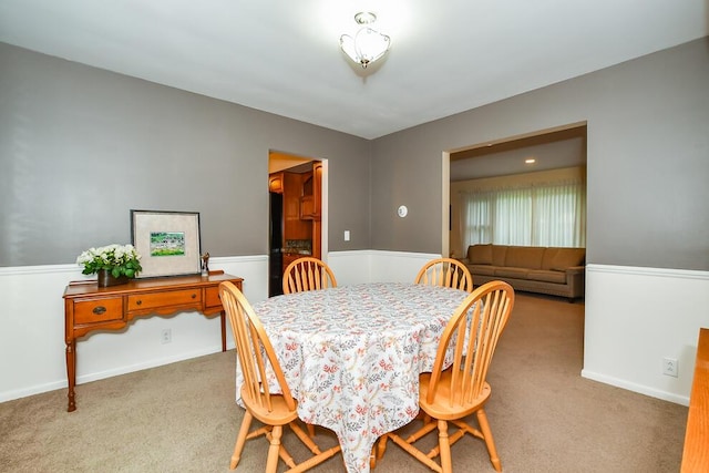 2707 Lomond Dr, Kalamazoo, MI 49008 - carpeted dining space featuring baseboards