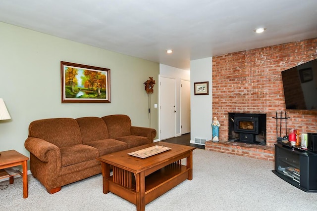 2707 Lomond Dr, Kalamazoo, MI 49008 - living area with carpet floors, a wood stove, and recessed lighting
