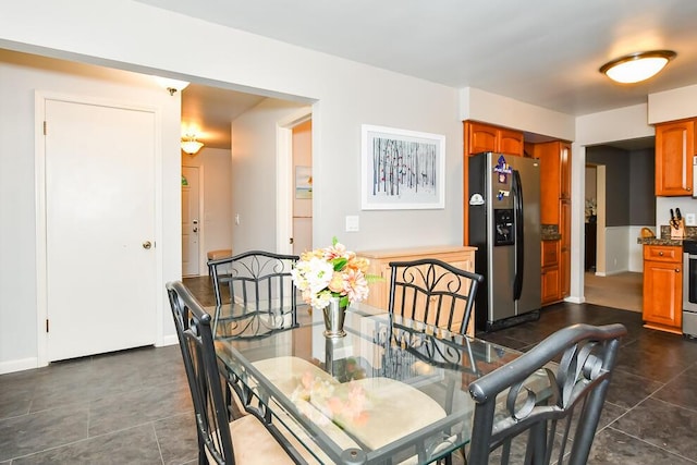 2707 Lomond Dr, Kalamazoo, MI 49008 - dining space featuring dark tile patterned flooring