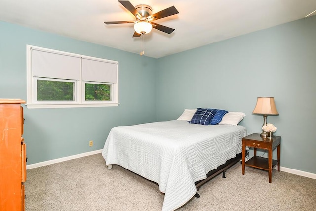 2707 Lomond Dr, Kalamazoo, MI 49008 - carpeted bedroom with baseboards and ceiling fan