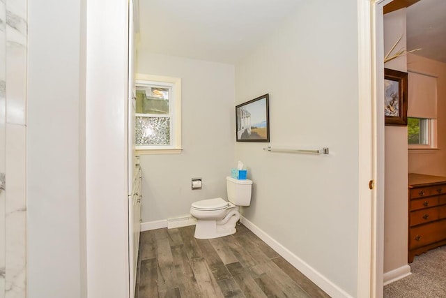 2707 Lomond Dr, Kalamazoo, MI 49008 - bathroom with toilet, wood finished floors, vanity, and baseboards