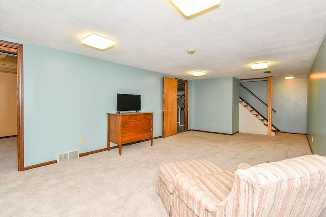 2707 Lomond Dr, Kalamazoo, MI 49008 - carpeted living area with stairs and baseboards