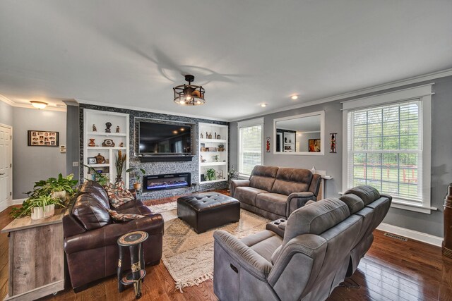 3725 S Creek Ln, Dryden, MI 48428 - living room with crown molding, wood-type flooring, baseboards, a fireplace, and built in shelves