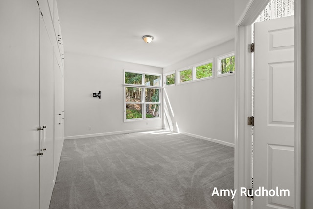 1995 W Glen Ct, Norton Shores, MI 49441 - carpeted empty room with baseboards