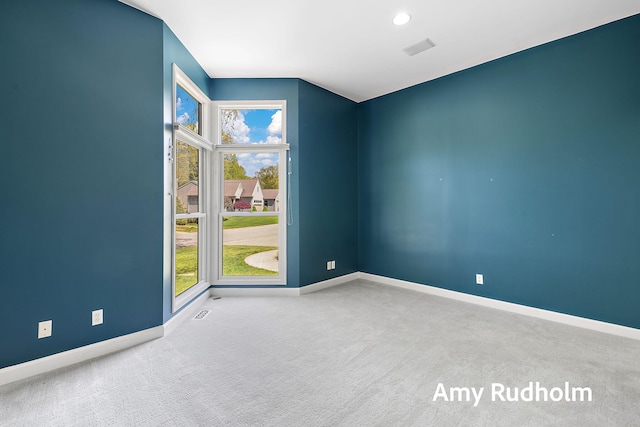 1995 W Glen Ct, Norton Shores, MI 49441 - carpeted empty room with baseboards