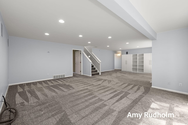 1995 W Glen Ct, Norton Shores, MI 49441 - unfurnished living room featuring stairway, carpet, baseboards, and recessed lighting