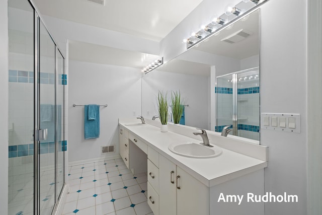 1995 W Glen Ct, Norton Shores, MI 49441 - full bathroom featuring a stall shower and double vanity