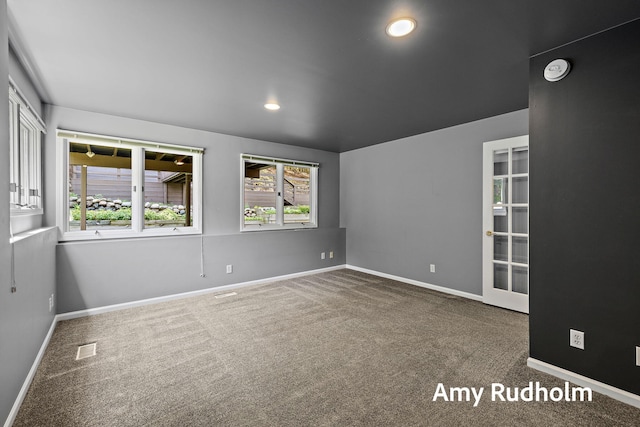 1995 W Glen Ct, Norton Shores, MI 49441 - carpeted empty room with healthy amount of natural light, baseboards, and recessed lighting