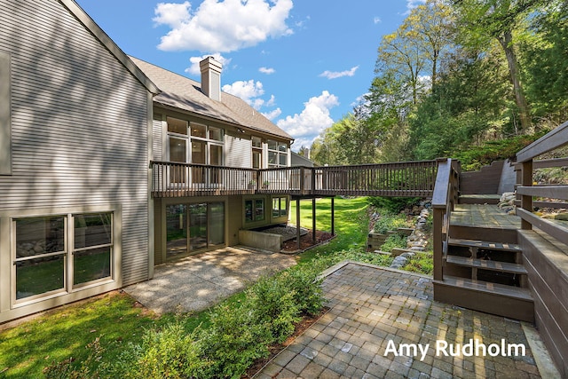 1995 W Glen Ct, Norton Shores, MI 49441 - deck with a patio and a yard