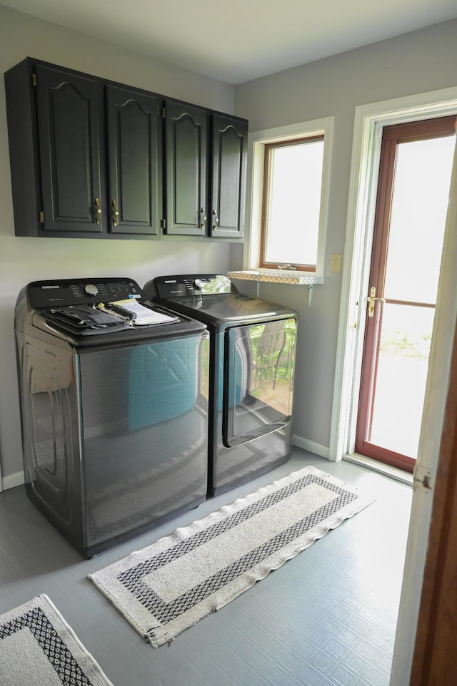 244 E Pearl St, Coldwater, MI 49036 - laundry room with washer and clothes dryer, cabinet space, and baseboards