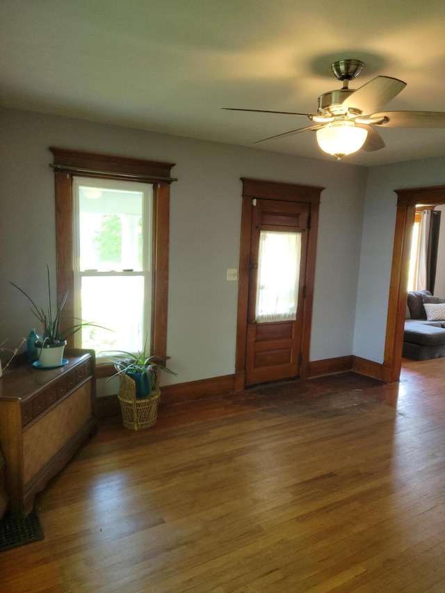 244 E Pearl St, Coldwater, MI 49036 - foyer with wood finished floors, baseboards, and ceiling fan