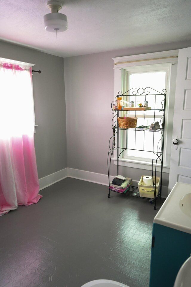 244 E Pearl St, Coldwater, MI 49036 - bathroom featuring a sink and baseboards