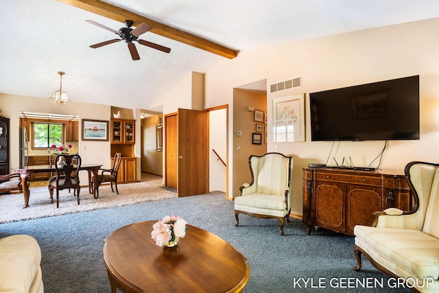 living area featuring carpet and ceiling fan