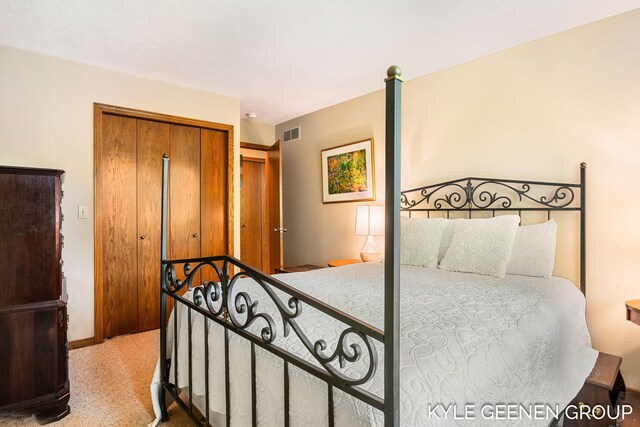 bedroom with carpet floors, a closet, and baseboards